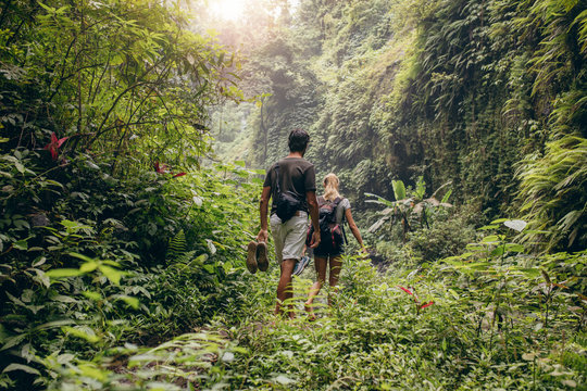 Young Couple Walking Through Woods