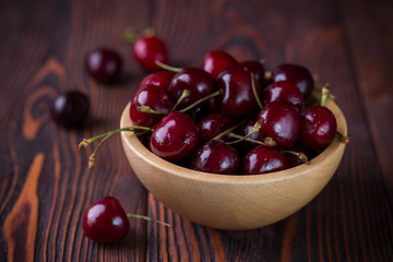 Cherry in a wooden bowl