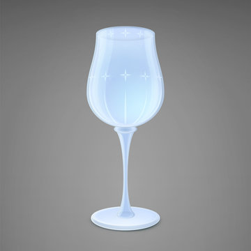 Wine glass. Isolated on a gray background. Shiny crystal with a pattern.