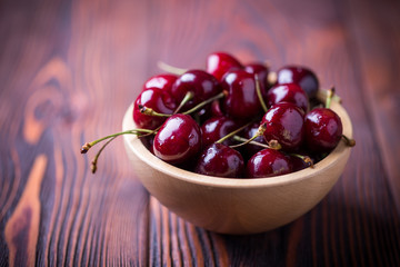 Cherry in a wooden bowl