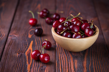 Cherry in a wooden bowl