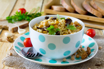 Vegetarian vegetable pilaf with chickpeas and wild mushrooms on