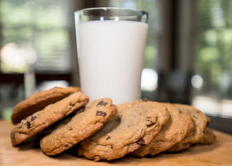 Chocolate Cookies Around a Glass of Milk Horizontal