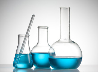 Laboratory glassware with blue liquid