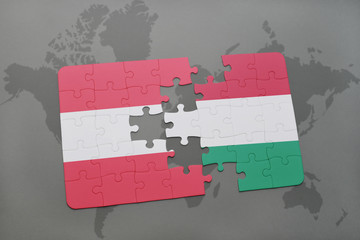 puzzle with the national flag of austria and hungary on a world map background.