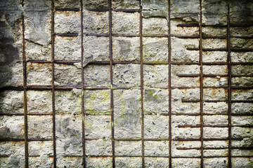 Vintage toned background made of reinforced concrete wall.