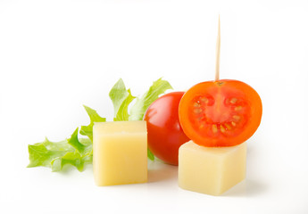 Canape. Cheese cubes with tomatoes isolated on white background
