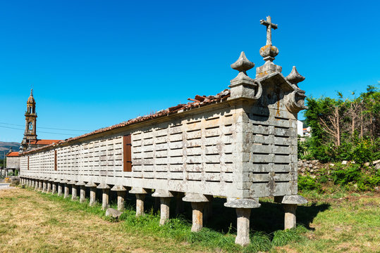 Horreo de Carnota against a clear blue sky