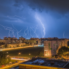 Many Lightnings Over Housing Estate. Night Storm in the City.