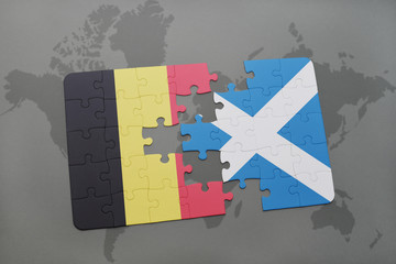 puzzle with the national flag of belgium and scotland on a world map background.