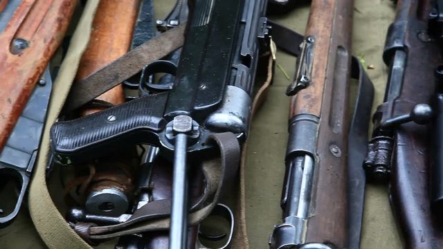 Close up of historical rifles and machine-guns