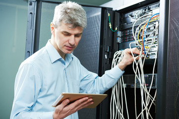 network engineer administrator in server room