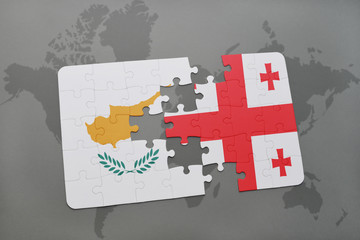 puzzle with the national flag of cyprus and georgia on a world map background.