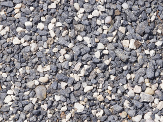 Abstract pebble stones background texture macro, selective focus