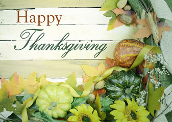 Cheerful fall or autumn border with fall leaves, nuts, sunflowers and squashes with green folded...