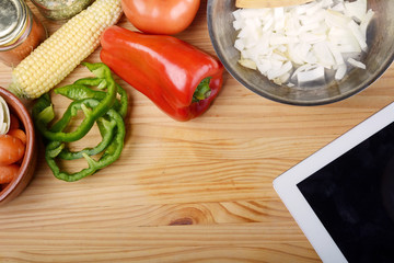 Vegetables with a digital tablet pc. Healthy food concept.