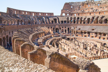 Fototapeta na wymiar ROME, ITALY - APRIL 8, 2016: Ruins of Coliseum, panoramic view with underground levels of gladiator's rooms and animal's cages