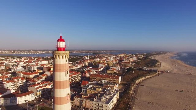 Lighthouse on the beach Praia Velha, Barra, Aveiro, Portugal aerial view