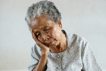 Senior asian woman was headache