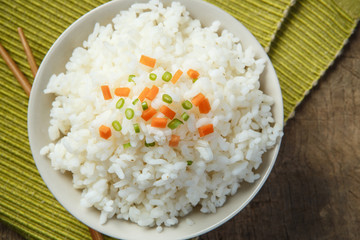 Cooked rice with chopsticks on a fabric mat