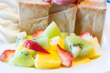 Honey toast with fruit and ice cream.