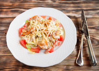 Tasty shrimps and grapefruit salad decorated with cheese