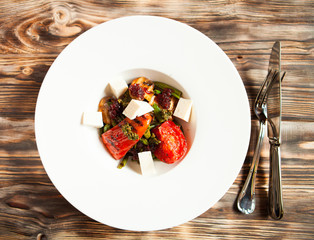 tasty tomatoes warm salad cheese and mushrooms