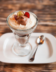 Sweet dessert - chocolate and vanilla pudding in glasses served