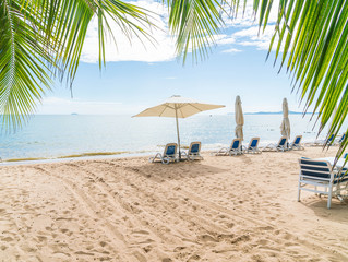 Fototapeta premium Outdoor with umbrella and chair on beautiful tropical beach and