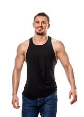 Muscular smiling young man posing