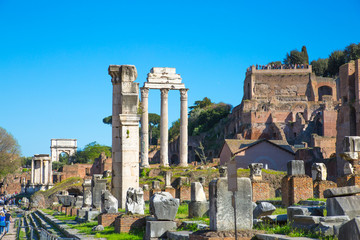 Fototapeta na wymiar ROME, ITALY - APRIL 8, 2016: Ruins and Columns the Temple of Castor and Pollux Roman's forum with ruins of important ancient government buildings started 7th century BC