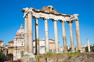 Obraz premium ROME, Ruins of old temple at Roman's forum against of blue sky