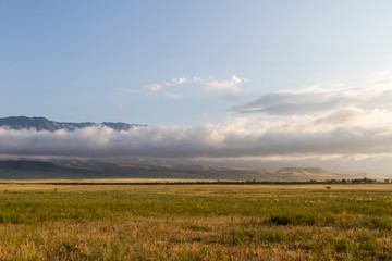 clouds in front of the mountains