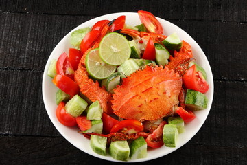Boiled crab and fresh vegetables.