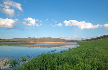 Snake River under cumulus cloud sky in Alpine Wyoming USA