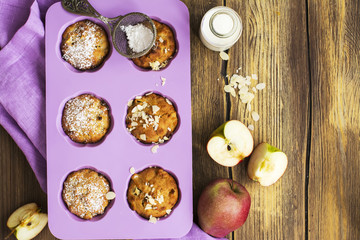 Apple cupcakes over wooden table