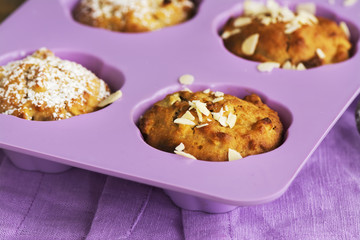 Apple cupcakes over wooden table