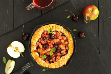 Apple and cherry pie with ingredients