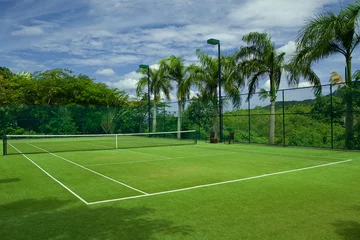 Poster tennis grass court good with  beautiful background © kireewongfoto