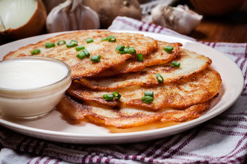 Potato pancakes with sour cream