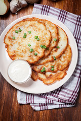 Potato pancakes with sour cream