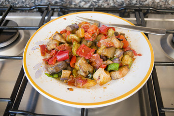 caponata with chopped fried eggplants, potatoes and tomatoes