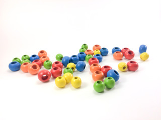 Colorful wooden beads isolated on white background.