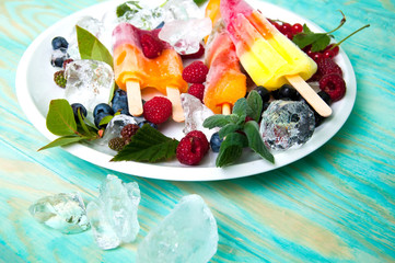 Composition of delicious ice cream, fruits and ice cubes