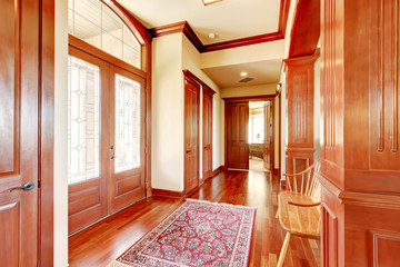 Bright foyer in luxury home with hardwood floor.