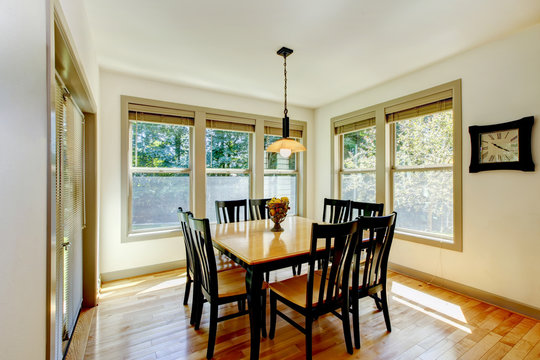 Dining area with wooden table set and hardwood floor