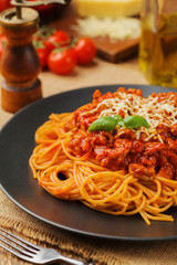 Delicious spaghetti served on a black plate