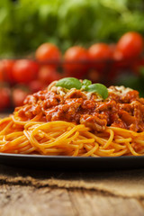 Delicious spaghetti served on a black plate