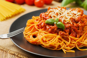 Delicious spaghetti served on a black plate