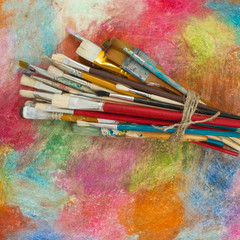 Obraz premium Brushes on a colorful background. The workplace of the artist. Banner for school